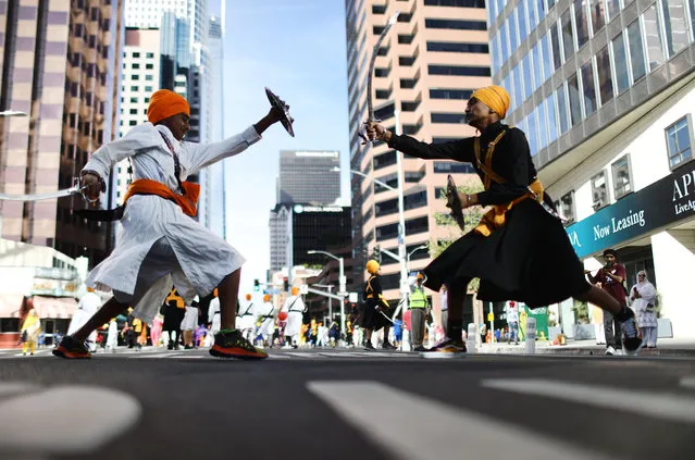 Young Sikhs practice traditional Indian martial arts during their annual parade marking Baisakhi, also known as Vaisakhi, on April 14, 2019 in downtown Los Angeles, California. Baisakhi marks the Sikh New Year and spring harvest festival in Punjab and Northern India. (Photo by Mario Tama/Getty Images)