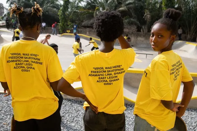 Attendees wearing t-shirt recognizing the late Virgil Abloh for his contribution to the skating community attend the opening of the Freedom Skate Park in Accra, Ghana, on December 15, 2021. The Freedom Skate Park is the first skate park and a recreational center created by the youth in Ghana. (Photo by Nipah Dennis/AFP Photo)