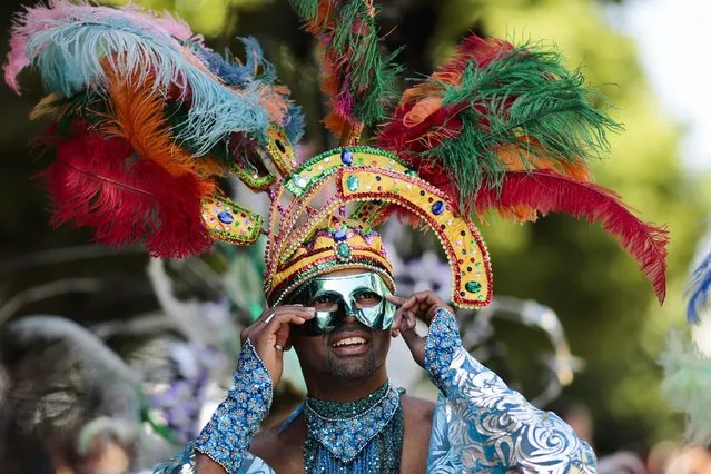 A samba dancer performs at the annual Carnival of Cultures parade in Berlin, Germany, Sunday, May 24, 2015. (Photo by Markus Schreiber/AP Photo)