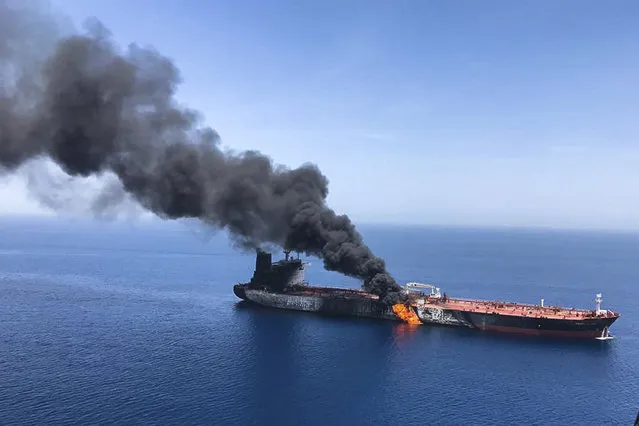 An oil tanker is on fire in the sea of Oman, Thursday, June 13, 2019. Two oil tankers near the strategic Strait of Hormuz were reportedly attacked on Thursday, an assault that left one ablaze and adrift as sailors were evacuated from both vessels and the U.S. Navy rushed to assist amid heightened tensions between Washington and Tehran. (Photo by AP Photo/ISNA)