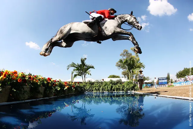 Kent Farrington of the United States makes a jump during the Jumping Competition at the Guadalajara Country Club