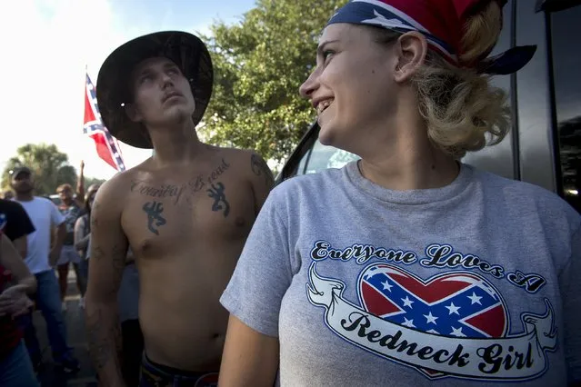 Destiny Mooneyham, 18, from Tampa talks to Dennis Wiles, (L) 20, from Tampa before a “Ride for Pride” event to show support for the Confederate flag in Brandon, Hillsborough County, June 26, 2015. (Photo by Carlo Allegri/Reuters)