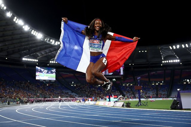 France's athlete Cyrena Samba-Mayela celebrates winning the women's 100m hurdles final during the European Athletics Championships at the Olympic stadium in Rome on June 8, 2024. (Photo by Anne-Christine Poujoulat/AFP Photo)