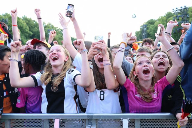 Germany fans cheer after the 2-0 goal for Germany during the UEFA Euro 2024 football match between Germany and Hungary at the public football viewing area in Berlin, Germany on June 19, 2024. (Photo by Jörg Carstensen/AFP Photo)