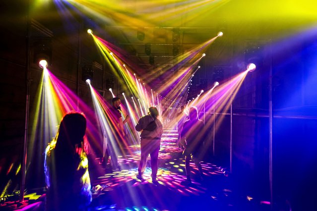 People view an installation of projections and lights called “Dark Spectrum” located at old tram tunnels as part of the annual Vivid Sydney festival in Sydney on May 24, 2024. (Photo by David GrayAFP Photo)