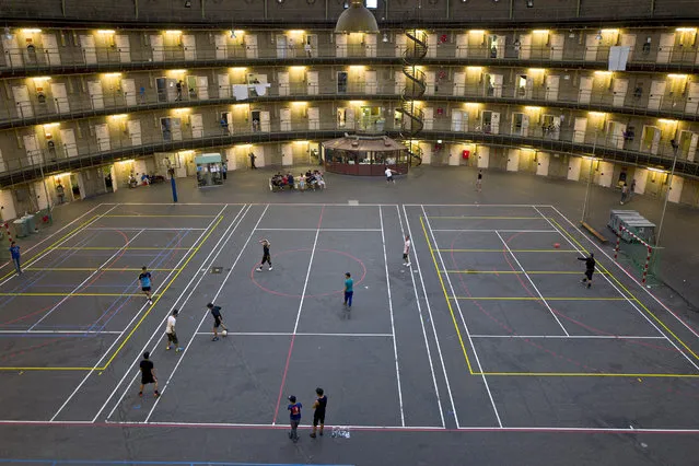 In this Tuesday, May 10, 2016 photo, refugees and migrants play football at the former prison of De Koepel in Haarlem, Netherlands. With crime declining in the Netherlands, the country is looking at new ways to fill its prisons. (Photo by Muhammed Muheisen/AP Photo)