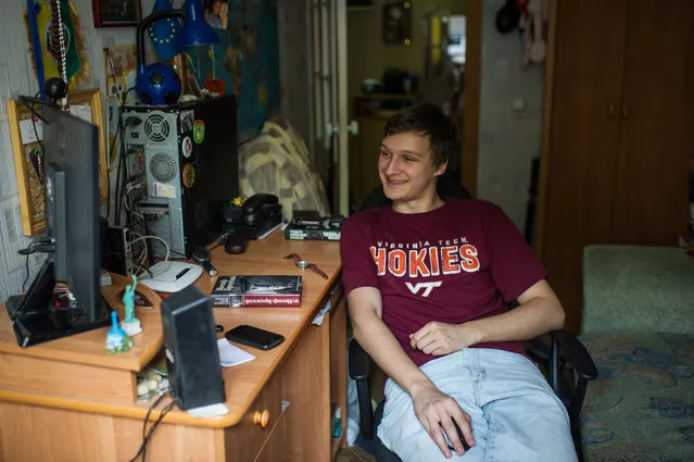 University student Valentyn Onyshchenko looks at his computer screen at his apartment in Kiev, on May 23, 2014. When Onyshchenko, 22, who speaks in Russian to his parents but identifies as Ukrainian, posted photos on Facebook of himself protesting the government last fall, some of his Russian friends quickly “started being rough and inappropriate,” he said. “We just stopped talking,” Onyshchenko said, and eventually they unfriended him. (Photo by Alexey Furman/The Washington Post)