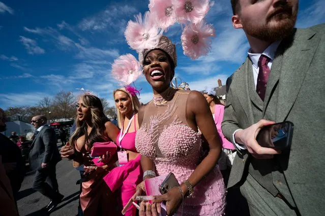 Racegoers are seen during Ladies' Day at Aintree Racecourse Liverpool, England, Friday, April 8, 2022. (Photo by Jon Super/AP Photo)