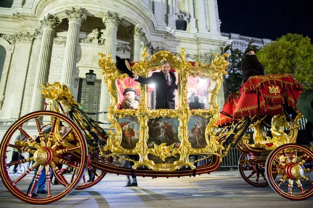 Lord Mayor Elect William Russell, soon to become the 692nd Lord Mayor of the City of London, rides in the Lord Mayor of London’s State Coach drawn by six shire horses as it prepares to leave Guildhall Yard during an early morning dawn rehearsal run on November 06, 2019 in London, England. The State Coach is the world's oldest ceremonial vehicle still in use and has been used in every Lord Mayor's Show since 1757. This coming Saturday it will be used to transport Lord Mayor William Russell over the three miles procession route of the show. William Russel will take his position on Friday 8th November. (Photo by Ollie Millington/Getty Images)