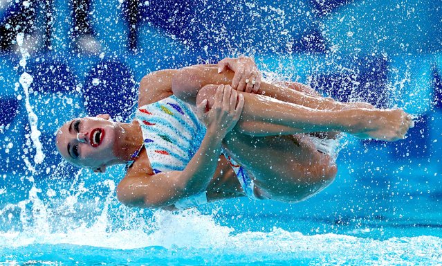 Sofia Evangelia Malkogeorgou and Evangelia Platanioti of Greece perform in the duet technical routine of the artistic swimming event during the Paris 2024 Olympic Games at the Aquatics Centre in Saint-Denis, north of Paris, on August 9, 2024. (Photo by Gonzalo Fuentes/Reuters)