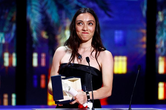 Turkish actress Merve Dizdar, Best Actress award winner for her role in the film “Kuru Otlar Ustune” (About Dry Grasses – Les herbes seches), reacts during the closing ceremony of the 76th Cannes Film Festival in Cannes, France on May 27, 2023. (Photo by Eric Gaillard/Reuters)