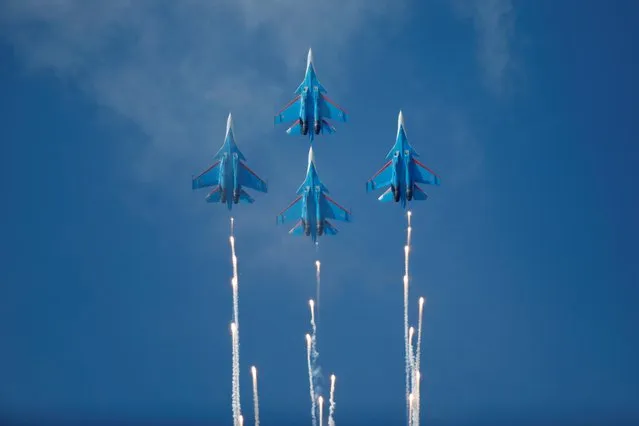 Su-30SM jets of the Russian Knights aerobatic team perform at an air show to mark the 80th anniversary of the victory in the Battle of Khalkhin Gol, in Ulaanbaatar, Mongolia on August 28, 2019. (Photo by B. Rentsendorj/Reuters)