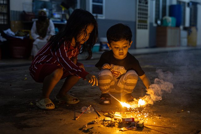 Children with sparklers ahead of Eid al-Fitr celebrations, on April 09, 2024 in Selangor, Malaysia. Malaysia celebrates Eid Al Fitr, also known as “Hari Raya Aidilfitri”, on Wednesday, April 10th, 2024, marking the beginning of Shawwal, the tenth month of the lunar calendar. Eid al-Fitr is an Islamic celebration signifying the conclusion of Ramadan's fasting, observed by Muslims around the world, as they gather for prayers, family reunions, and joyful festivities. (Photo by Annice Lyn/Getty Images)