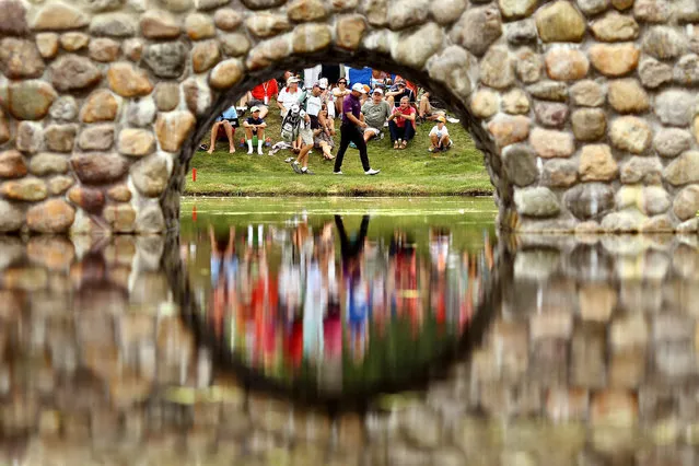 Graeme McDowell of Northern Ireland and caddie Ken Combos walk to the third green during the third round of the World Golf Championships – Bridgestone Invitational at Firestone Country Club South Course on August 8, 2015 in Akron, Ohio. (Photo by Richard Heathcote/Getty Images)