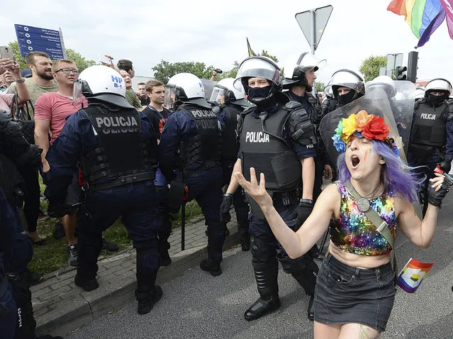 LGBT activists and their supporters gather for the first-ever pride parade in the central city of Plock, Poland, Saturday Aug. 10, 2019. Despite the war in Ukraine, the country's largest LGBT rights event, KyivPride, is going ahead on Saturday, June 25, 2022. But not on its native streets and not as a celebration of gay pride. It will instead join Warsaw's yearly Equality Parade, using it as a platform to keep international attention focused on the Ukrainian struggle for freedom. (Photo by Czarek Sokolowski/AP Photo/File)