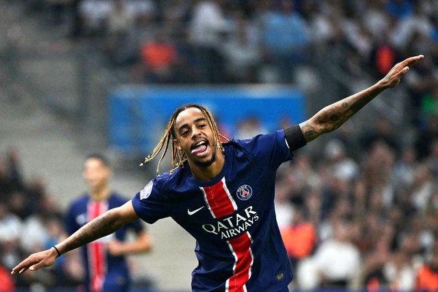 Paris Saint-Germain's French forward #29 Bradley Barcola celebrates after scoring his team's third goal during the French L1 football match between Olympique de Marseille (OM) and Paris Saint-Germain (PSG) at the Velodrome Stadium in Marseille, southeastern France, on October 27, 2024. (Photo by Miguel Medina/AFP Photo)