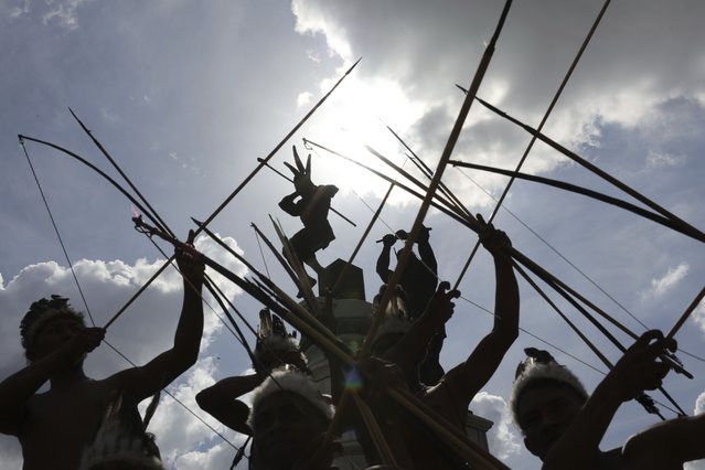 Indigenous people take part in Venezuelan “Indigenous Resistance Day” in Caracas, Venezuela, Saturday, October 12, 2024, marking 532 years since Cristobal Colon (Christopher Columbus) arrived in the Americas. (Photo by Jesus Vargas/AP Photo)
