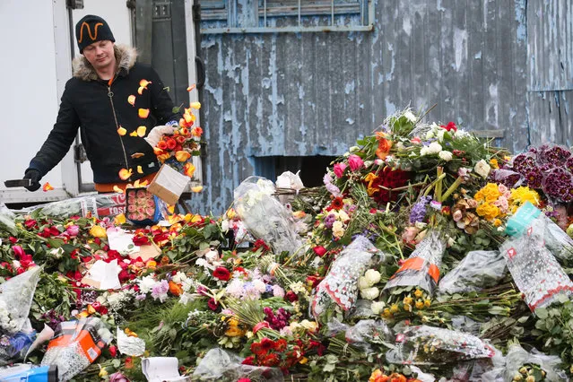 The disposal of unsold flowers at the location of the former Pulkovskiye Tsvety (Pulkovo Flowers) enterprise in St Petersburg, Russia on April 13, 2020, amid the ongoing COVID-19 pandemic. (Photo by Peter Kovalev/TASS)