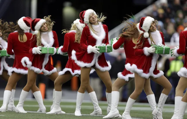 New England Patriots cheerleaders, dressed in Santa Claus outfits, perform in the second quarter of an NFL football game against the Cleveland Browns  Sunday, December 8, 2013, in Foxborough, Mass. (Photo by Steven Senne/AP Photo)