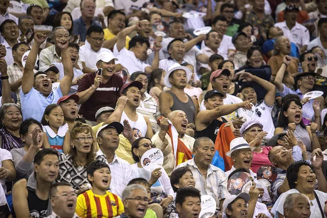 Fans react after a Mongolian wrestler defeats a Japanese opponent during the 2016 World Sumo Championship on July 30, 2016 in Ulaanbaatar, Mongolia. (Photo by Taylor Weidman/Getty Images)