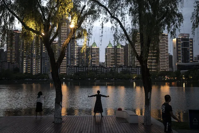 The resident womens physical exercise in Xibei lake park on May 11, 2020 in Wuhan, China. The government has begun lifting outbound travel restrictions after almost 11 weeks of lockdown to stem the spread of COVID-19. (Photo by Getty Images/China Stringer Network)