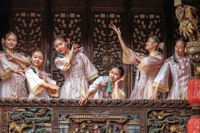 Artists perform during a “Yandu Story” Show performance, in Yancheng, Jiangsu province, China, 20 September 2022. The story dates back to some 100 years when – according to the organizers – two prominent local families, Gu and Ling, were committed to get out of a predicament, but parted due to different development concepts and ended in a turmoil. The large-scale immersive series of performances took more than a year of careful planning and consists of two parts: a daytime performance and a 90-minute night performance, they added. (Photo by Alex Plavevski/EPA/EFE/Rex Features/Shutterstock)