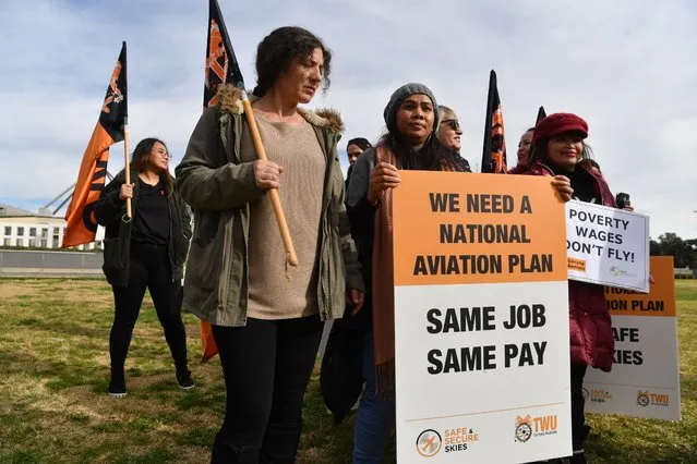 TWU workers are seen during a protest in front of Parliament House on June 10, 2020 in Canberra, Australia. The federal government is expected to make adjustments to the $70 billion Jobkeeper program which was introduced to help businesses retain staff during COVID-19 shutdowns. (Photo by Sam Mooy/Getty Images)