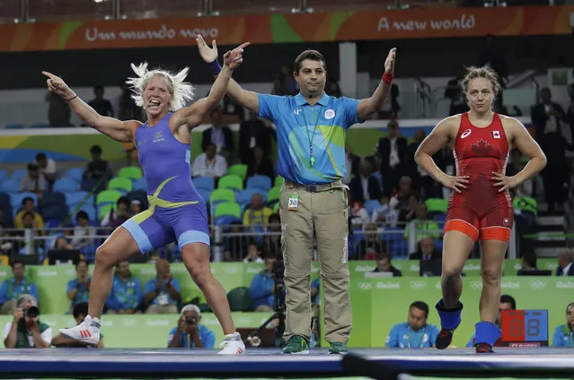 Sweden's Anna Jenny Fransson, left, celebrates after beating Canada's Dorothy Erzsebet Yeats in the women's wrestling freestyle 69-kg competition bronze medal round at the 2016 Summer Olympics in Rio de Janeiro, Brazil, Wednesday, August 17, 2016. (Photo by Markus Schreiber/AP Photo)