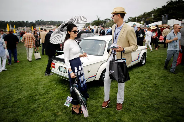 Guests attend the Concours d'Elegance in Pebble Beach, California, U.S. August 21, 2016. (Photo by Michael Fiala/Reuters/Courtesy of The Revs Institute)