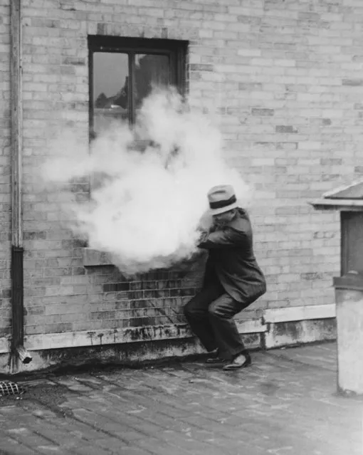 An experimental “mechanical guard” to protect children and adults within a home, shoots out a burst of tear gas to repel would-be criminals. The device is demonstrated by Lloyd Curtiss, engineer of federal laboratories, Pittsburgh, Pa., May 17, 1932. (Photo by AP Photo)