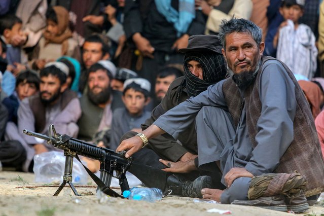 Taliban security members keep watch as Afghan wrestlers fight at a makeshift wrestling arena in Kabul, Afghanistan, 04 April 2025. (Photo by Samiullah Popal/EPA/EFE)
