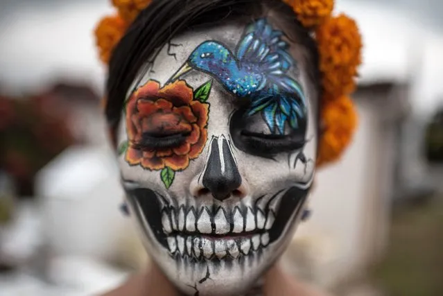 A closeup of a woman’s makeup during the festival of Santa Muerte, a folk saint who personifies death in the form a skeleton in Coatepec, Mexico on October 31, 2022. (Photo by Hector Adolfo Quintanar Perez/ZUMA Press Wire/Rex Features/Shutterstock)