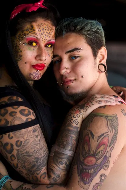 Ecuadorean body modification and tattoo artists Richard Velez, 21, and his wife Andrea Aguilar, 26, show off their work at the Quito Tattoo Convention in Quito, Ecuador September 27, 2015. (Photo by Guillermo Granja/Reuters)