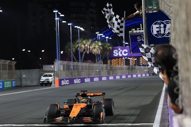 McLaren's Australian driver Oscar Piastri crosses the finish line to win the 2025 Saudi Arabia Formula One Grand Prix at the Jeddah Corniche Circuit on April 20, 2025. (Photo by Thaier Al-Sudani/AFP Photo)