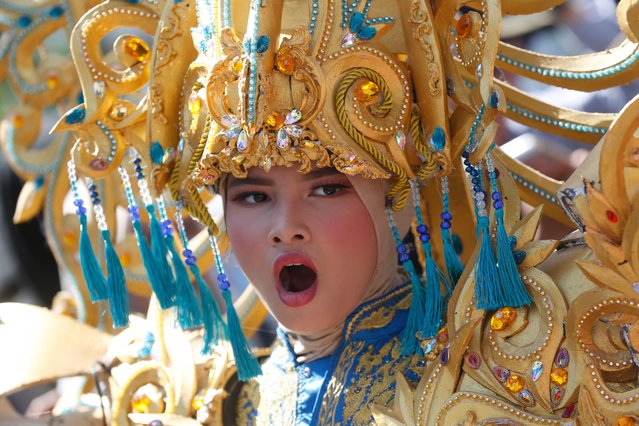 A student participates in a cultural parade to mark the 80th Independence Day celebrations in Banda Aceh, Indonesia, 18 August 2025. Indonesia is celebrating the 80th anniversary of its independence from the Netherlands, which was proclaimed on 17 August 1945. (Photo by Hotli Simanjuntak/EPA)