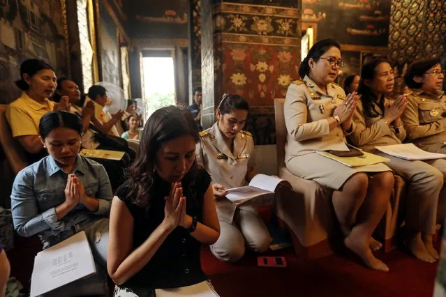 People pray during special prayers for Thai King Bhumibol Adulyadej at Wat Pathumwanaram temple on Monday, October 10, 2016 in Bangkok, Thailand.The health of Thailand's 88-year-old king has deteriorated and is in an “unstable condition” said the palace on Sunday night. According to reports, Bhumibol, the world's longest-reigning monarch, has been placed on a ventilator with his ailing health. (Photo by Dario Pignatelli/Getty Images)