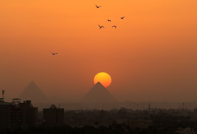 This photo taken on April 19, 2025 shows the Giza Pyramids at sunset seen from Cairo, Egypt. (Photo by Xinhua News Agency/Rex Features/Shutterstock)