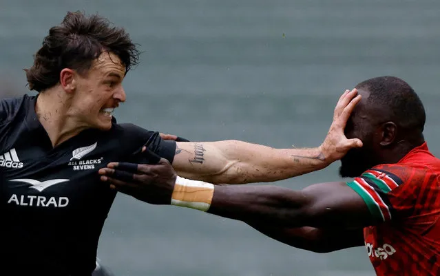 New Zealand's Leroy Carter is seen in action with Kenya's Herman Humwa during a rugby match, at the Sevens World Cup in Hong Kong.on March 31, 2023. (Photo by Tyrone Siu/Reuters)