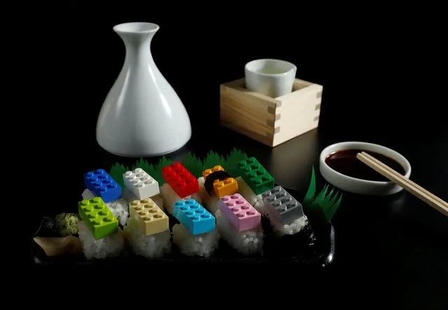 Lego bricks weighing a total of 22 grams, which is equivalent to the amount of plastic that someone could eat in one month, are displayed on top of pieces of sushi rice in this illustration taken in Tokyo, Japan, November 11, 2020. People could be ingesting the equivalent of a credit card of plastic a week, a 2019 study by WWF International concluded, mainly in plastic-infused drinking water but also via food like shellfish, which tends to be eaten whole so the plastic in their digestive systems is also consumed. Reuters used the findings of the study to illustrate what this amount of plastic actually looks like over various periods of time. (Photo by Kim Kyung-Hoon/Reuters)
