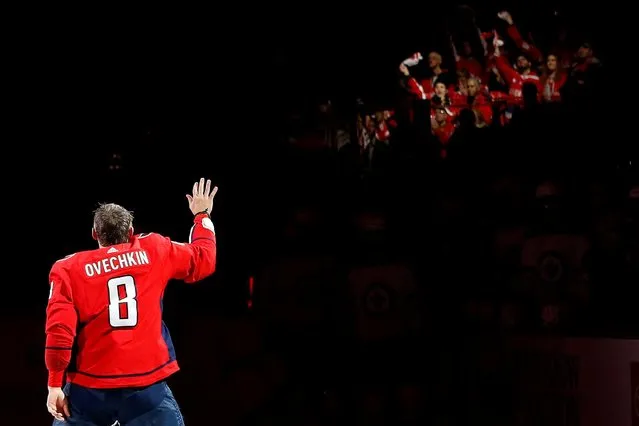 Washington Capitals left wing Alex Ovechkin (8) waves to the crowd prior to a ceremony honoring his 700th NHL goal prior to the Capitals' game against the Winnipeg Jets at Capital One Arena in Washington, District of Columbia on February 25, 2020. (Photo by Geoff Burke/USA TODAY Sports)