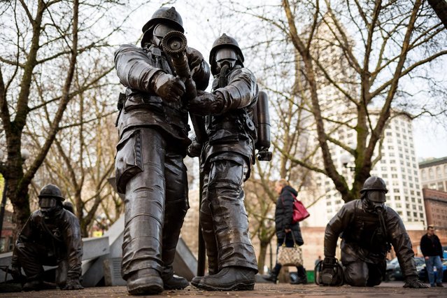 The Firefighters Memorial statue in Pioneer Square stands Tuesday, January 6, 2015, in Seattle, Wash. The memorial honors the four firefighters that died in the conflagration, making it the worst tragedy in the history of the Seattle Fire Department. (Photo by Jordan Stead/AP Photo)
