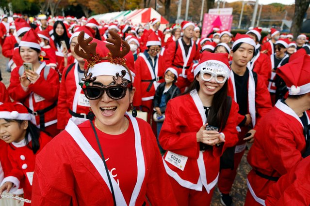 People dressed in Santa Claus outfits participate in the Santa Parade in Tokyo, Japan, 16 November 2025. The 'Santa Parade' is a winter tradition and charity event that brings Christmas joy to children battling illnesses in Japan by delivering gifts. (Photo by Franck Robichon/EPA)
