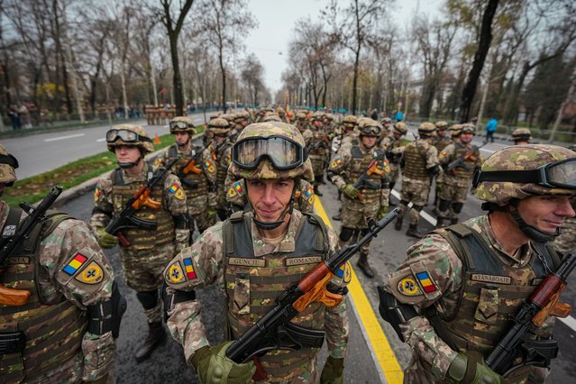 Romanian servicemen stand in formation before the national day military parade, in Bucharest, Romania, Monday, December 1, 2025. (Photo by Andreea Alexandru/AP Photo)