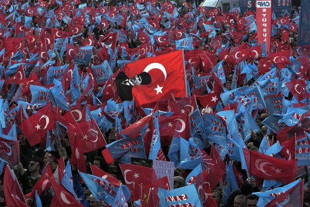 Supporters wave Turkish and CHP party flags during an election campaign rally of the leader and Nation Alliance's presidential candidate Kemal Kilicdaroglu, in Istanbul, Turkey, Saturday, May 6, 2023. (Photo by Khalil Hamra/AP Photo)