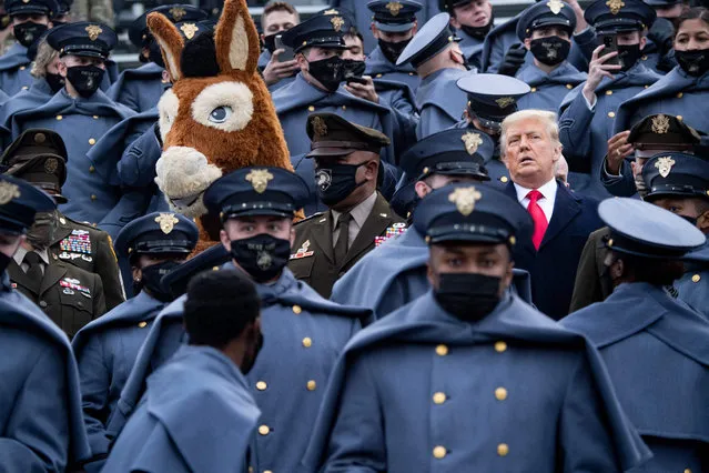 US President Donald Trump joins West Point cadets during the Army-Navy football game at Michie Stadium on December 12, 2020 in West Point, New York. (Photo by Brendan Smialowski/AFP Photo)