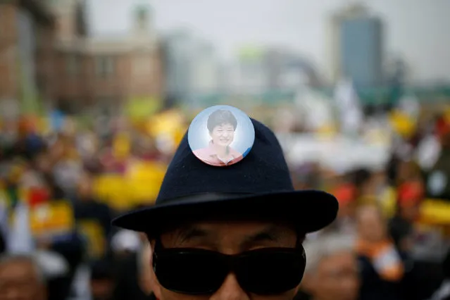 A badge depicting an image of South Korean President Park Geun-hye is seen on a hat of her supporter during a rally opposing calls for her resignation, in Seoul, South Korea, November 19, 2016. (Photo by Kim Hong-Ji/Reuters)