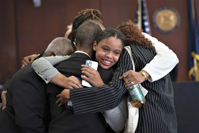 Aretha Franklin's granddaughter Grace Franklin, 17, smiles while embracing her family members after the jury decided in favor of a 2014 document during a trial over her grandmother's wills at Oakland County Probate Court in Pontiac, Mich., on Tuesday, July 11, 2023. The Queen of Soul died in 2018 at age 76. (Photo by Sarahbeth Maney/Detroit Free Press via AP Photo)