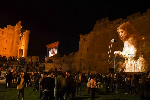 Pictures of Lebanese singer Fayrouz are projected on the Roman ruins of the Baalbek Temples, in an event to celebrate her birthday, in the Bekaa valley in eastern Lebanon November 21, 2016. (Photo by Hassan Abdallah/Reuters)