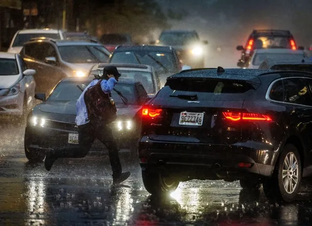 Heavy rain clogs up Georgia avenue as a possibly large and destructive storm system bears down on the region in Silver Spring, MD on August 7, 2023. (Photo by Bill O'Leary/The Washington Post)