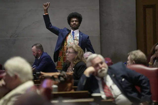 Rep. Justin J. Pearson, D-Memphis, raises his fist to acknowledge people in the gallery during a special session of the state legislature, Monday, August 21, 2023, in Nashville, Tenn. (Photo by George Walker IV/AP Photo)